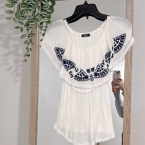 Blue accents on flowey shirt